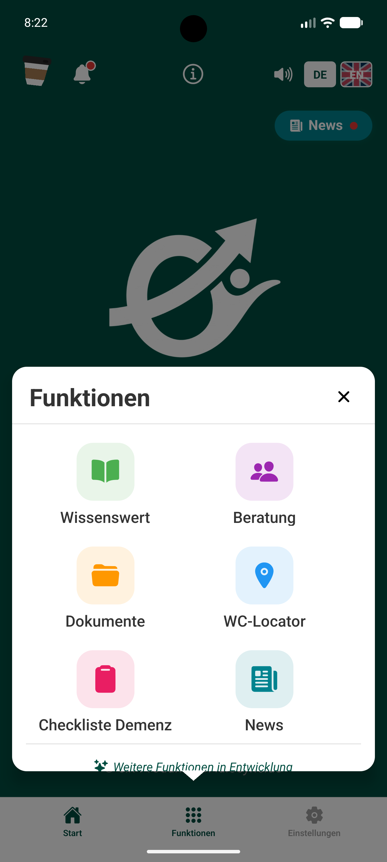 Menü „Funktionen“ mit sechs Kacheln: Wissenswert, Beratung, Dokumente, WC-Locator, Checkliste Demenz und News, darunter der Hinweis „Weitere Funktionen in Entwicklung“.